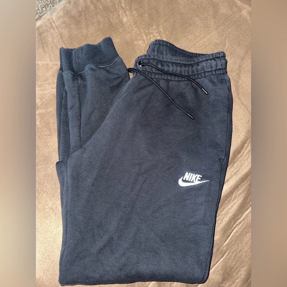 Nike sweatpants black with small hole pictured
